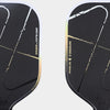 Close-up of the paddle face, featuring a matte black surface with the classic Inferno pattern and Luzz logo at the bottom.